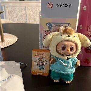 Pop Mart THE MONSTERS × Hello Kitty and Friends Series- (Pompompurin)